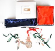 Four modern Braybrook & Britten hallmarked silver Christmas tree decorations comprising holly,