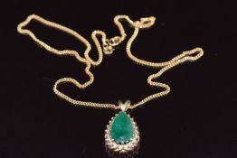 A 9ct gold pendant set with a pear cut emerald measuring approximately 16 x 11 x 5.6mm surrounded by