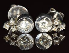 A pair of 18k white gold earrings each set with four diamonds, 3.2g