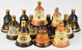Fourteen Bell's Old Scotch Whisky commemorative ceramic decanters, the majority 70cl, 40% vol.