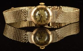Omega 9ct gold ladies wristwatch with black hands, two-tone baton hour markers, silver dial and