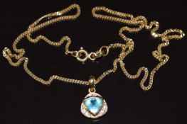 An 18ct gold pendant set with a trillion cut topaz and diamonds, on 18k gold chain, 4.4g, 40cm