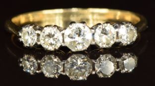 An 18ct gold ring set with five diamonds in a platinum setting, 2.1g, size M