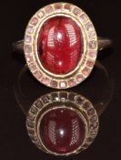 Georgian / Victorian 15ct gold ring set with a foiled garnet cabochon surrounded by foiled garnets