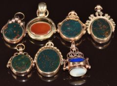 Five c1920 9ct gold swivel fobs set with blood stone and agate, a 9ct rose gold swivel fob set