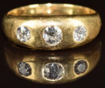 An 18ct gold ring set with three old cut diamonds, the larger approximately 0.25ct, 7.2g, size R