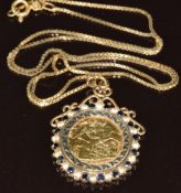 1982 gold half sovereign in 9ct gold mount set with sapphires and cubic zirconia, on 9ct gold chain,
