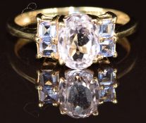 A 9k gold ring set with an oval cut morganite and tanzanite, 2.5g, size N