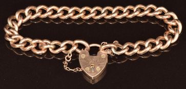 A 9ct rose gold curb link bracelet with a 9ct rose gold heart padlock clasp, 12.1g, 19cm