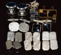 Six pairs of silver cufflinks and one other pair
