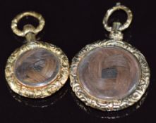 Two Victorian mourning lockets with engine turned decoration, verso a locket compartment