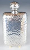 Victorian or Edward VII hallmarked silver hip flask with Arts & Crafts hammered decoration, London