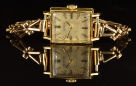 Buren 18ct gold ladies wristwatch with black hands, baton hour markers, silver dial and signed 17