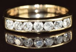 A 9k gold half eternity ring set with seven round cut diamonds, each approximately 0.1ct, 2.3g, size
