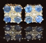 A pair of 9ct gold earrings each set with a diamond and four sapphires, 1.9g