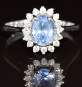 An 18k white gold ring set with an oval cut Ceylon sapphire of approximately 1.5ct surrounded by