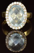A 14k gold ring set with a briolette cut aquamarine surrounded by diamonds, 6g, size O