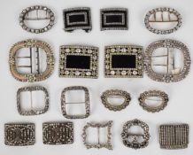 A collection of Georgian, Victorian and Art Deco buckles set with paste, including seven pairs and