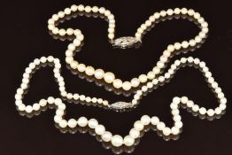 Two strands of cultured pearls, both with 9ct white gold clasps set with diamonds, 38 & 50cm