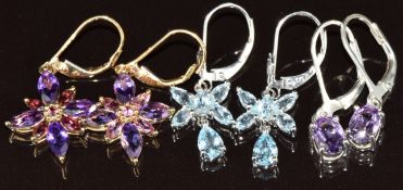 Two pairs of 9ct white gold earrings set with amethyst and topaz and a pair of 9ct gold earrings set