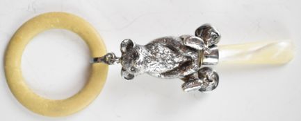 Hallmarked silver novelty baby's rattle with mother of pearl handle and teddy bear body,