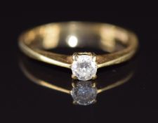 An 18ct gold ring set with a round cut diamond of approximately 0.2ct, 2g, size K