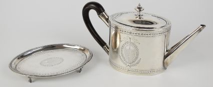 Georgian hallmarked silver teapot, with bright cut decoration, on stand raised on ball and claw