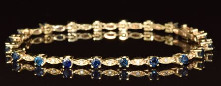 A 9ct gold tennis bracelet set with sapphires and diamonds, 9.2g, 17.5cm