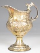 Georgian hallmarked silver cream jug, with embossed decoration, London 1762, makers mark indistinct,