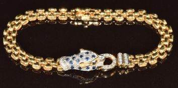 An 18ct gold bracelet in the form of a panther, set with diamonds and sapphires, 18.5g, 18.5cm