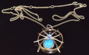 A 9ct gold pendant in the form of a spider set with faux turquoise and moonstone (2.7cm) on 9ct gold