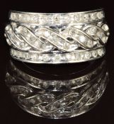 A 10k white gold ring set with diamonds in a channel setting, 5.7g, size N