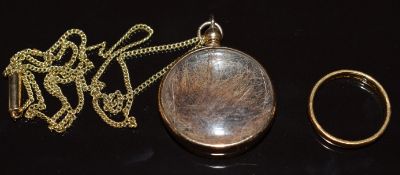 A 22ct gold wedding band / ring (3.1g, size K) and a yellow metal locket set with hair on 15ct