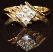 An 18ct gold ring set with four diamonds, 3.7g, size L