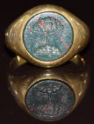 An 18ct gold signet ring set with a bloodstone intaglio seal carved with an oak tree, 6.7g, size K
