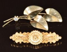 A 15ct gold brooch hallmarked Birmingham 1893 (2g, 4cm) and a 9ct gold brooch in the form of