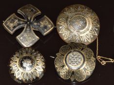 Four Victorian tortoiseshell brooches with inlaid gold and silver decoration
