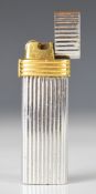Christian Dior Paris silver and gold plated cigarette lighter with reeded decoration, height 7cm