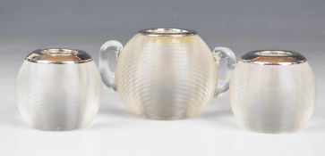 Three glass match strikers comprising a pair with hallmarked silver rims, Birmingham 1921, maker A J
