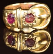 An 18ct gold buckle ring set with a ruby and paste in star settings, London 1908, 9.9g, size O