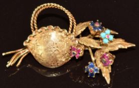 An 18ct gold trembler brooch in the form of a basket of flowers set with rubies, sapphires and