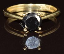 An 18k gold ring set with a round cut black diamond of approximately 1ct, 2.3g, size L