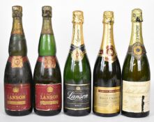 Five bottles of Champagne comprising Louis Roederer Brut Premier, Achille Morat & Cie Cuvee de