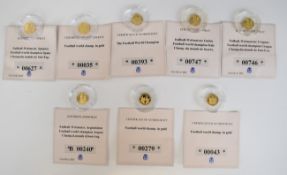 Eight limited edition 585 gold coins 'Football World Champions', each coin 0.5g, with certificates