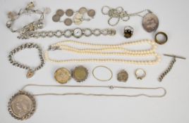 A collection of silver jewellery including curb link bracelet, charm bracelet, locket, watch, 1890