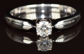 An 18ct white gold ring set with a round cut diamond of approximately 0.23ct, 2.8g, size M