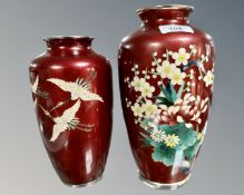 Two 20th century Japanese red cloisonne vases depicting storks in flight, height 21.