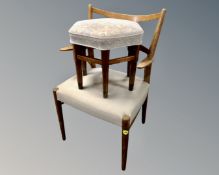 A 20th century Continental beech elbow chair together with a hexagonal beech footstool upholstered