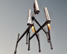 Three adjustable sawhorse stands.