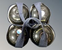 A set of four Henselite lawn bowls.